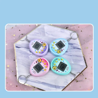 صورة ألعاب ألعاب إلكترونية للحيوانات الأليفة من Tamagotchi ، ألعاب حيوانات رقمية إلكترونية افتراضية للأطفال ، طفل